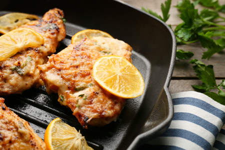 Tasty Italian chicken piccata in frying pan, closeupの写真素材