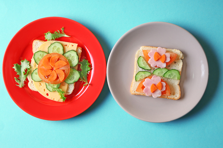 Plates with creative sandwiches on color backgroundの写真素材
