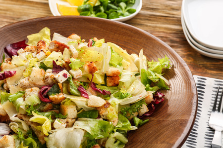 Plate with chicken salad on tableの写真素材