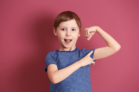 Cute little boy on color backgroundの写真素材