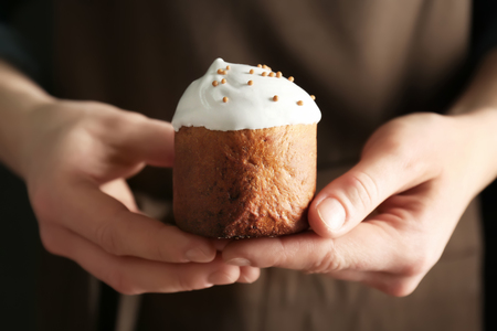 Woman holding traditional Russian Easter cake, closeupの写真素材
