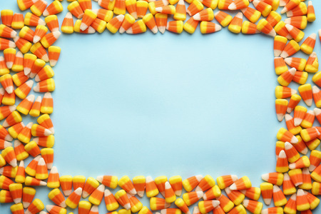 Colorful Halloween candy corns on blue backgroundの写真素材