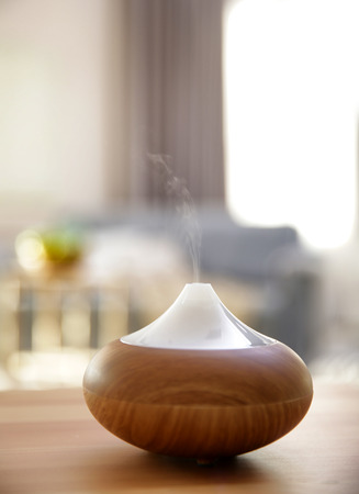 Electric oil diffuser on blurred room backgroundの写真素材