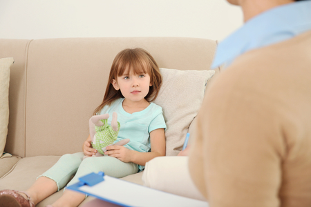 Young child psychologist working with little girlの写真素材