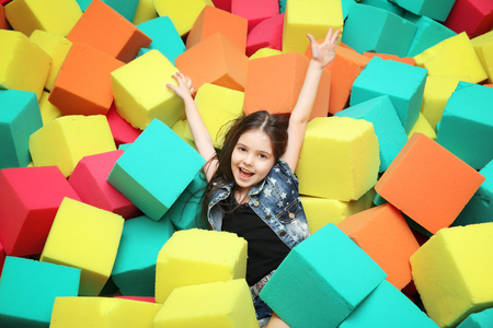 Cute girl playing with soft cubesの写真素材