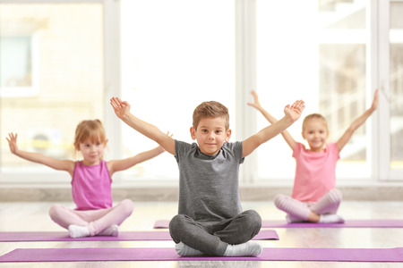 Group of children doing gymnastic exercisesの写真素材