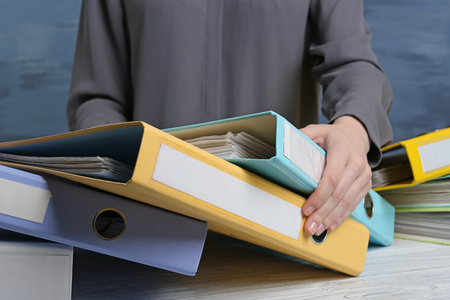 Closeup view of woman with document foldersの写真素材