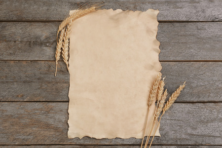 Sheet of paper with space for text on wooden backgroundの写真素材