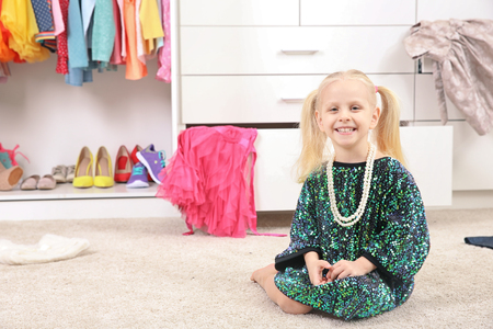 Cute fashion girl sitting on floorの写真素材