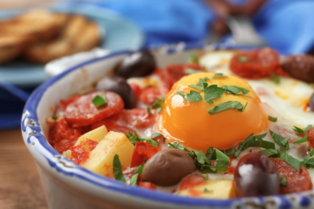 Baking dish with tasty Spanish baked egg, closeupの写真素材