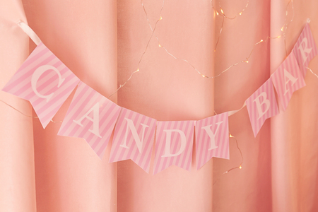 Garland of flags with letters CANDY BAR on curtain backgroundの写真素材