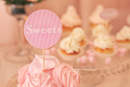 Tasty marshmallows on table with sweetsの写真素材