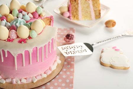 Sliced Easter cake on festive table