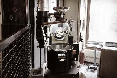 Modern coffee roaster in cafeの写真素材