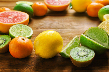 Beautiful composition of tropical fruits on wooden backgroundの写真素材