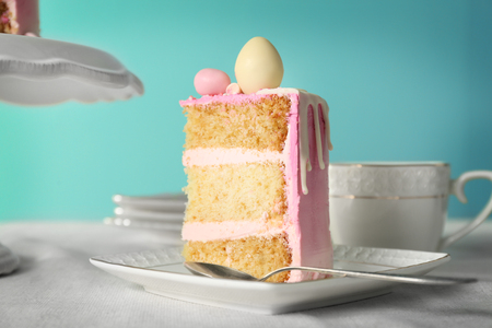 Tasty Easter cake slice on white saucerの写真素材