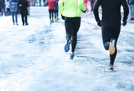 Marathon race on winter streetの写真素材