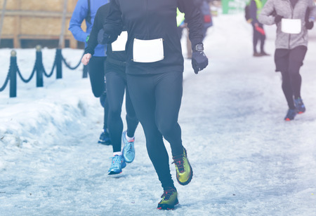 Marathon race on winter streetの写真素材