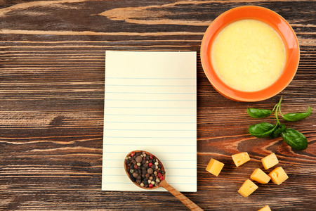 Still life with food ingredients and blank paper on tableの写真素材