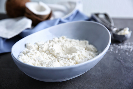 Bowl with fresh coconut ice cream on tableの写真素材