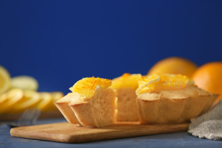 Delicious citrus cake on cutting boardの写真素材