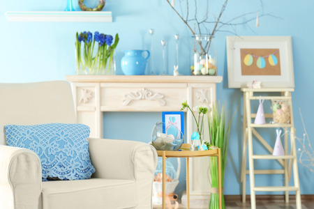 Festive interior of light room decorated with Easter symbolsの写真素材