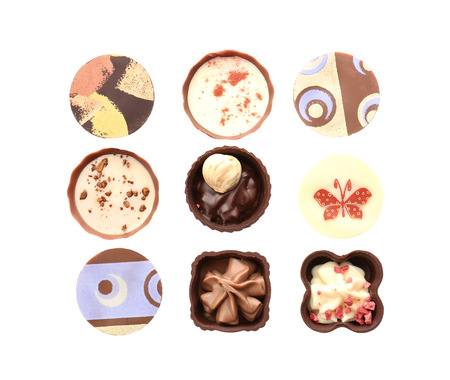 Delicious chocolate candies, isolated on whiteの写真素材