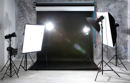 Modern photo studio interior with professional lighting equipment