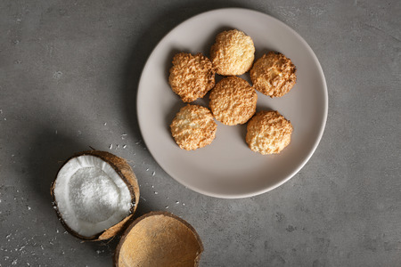 Plate with delicious coconut macaroons on tableの写真素材