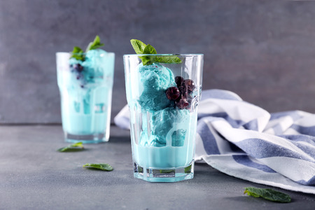 Tasty color ice cream with mint on tableの写真素材