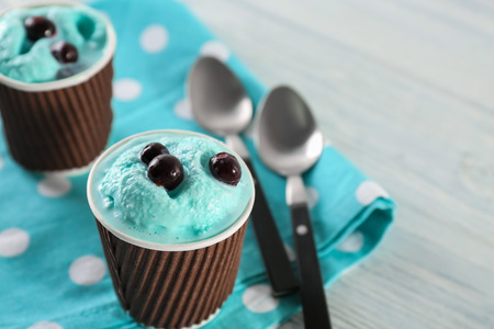 Tasty ice cream with blueberries on tableの写真素材