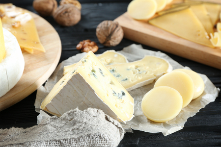Composition with variety of cheese on wooden tableの写真素材