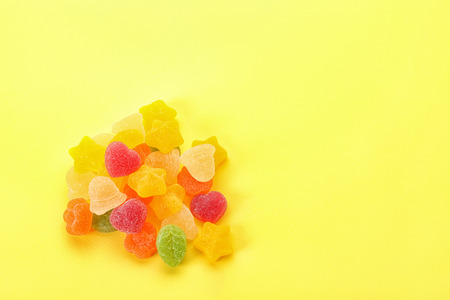 Tasty jelly candies on color backgroundの写真素材