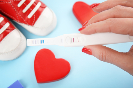 Pregnancy test in female hand, closeupの写真素材