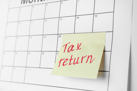 Note with text and calendar. Tax return conceptの写真素材