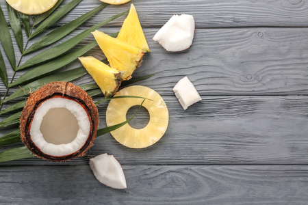 Pineapple and coconut on wooden backgroundの写真素材