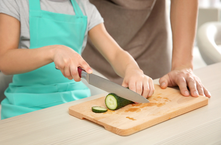 Dad and son cooking at home, closeupの写真素材