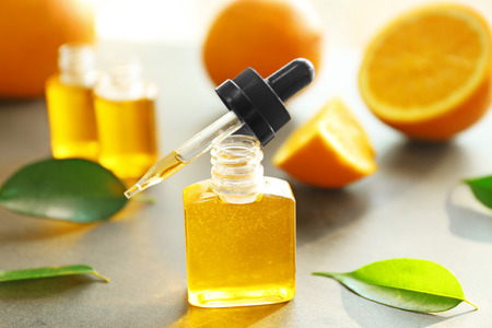 Bottles with essential oil on tableの写真素材