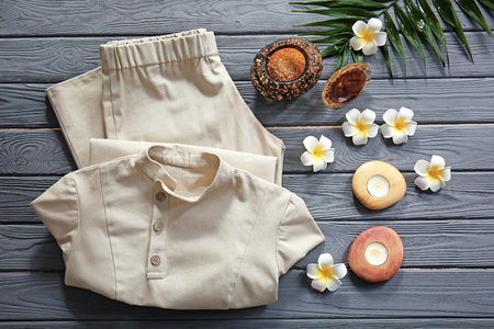 Composition with spa uniform on wooden tableの写真素材