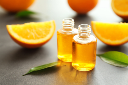 Two bottles with perfume on tableの写真素材