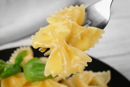 Fork with tasty pasta and cheese sauce, closeupの写真素材