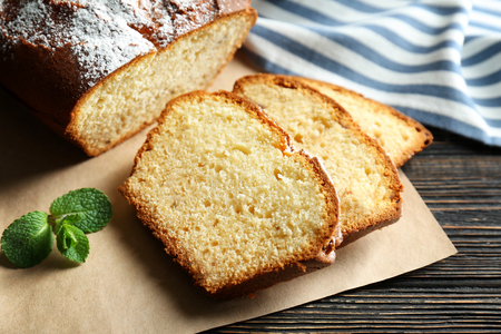 Delicious sliced yogurt cake with raisins on cutting boardの写真素材