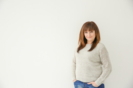 Beautiful mature woman on white backgroundの写真素材