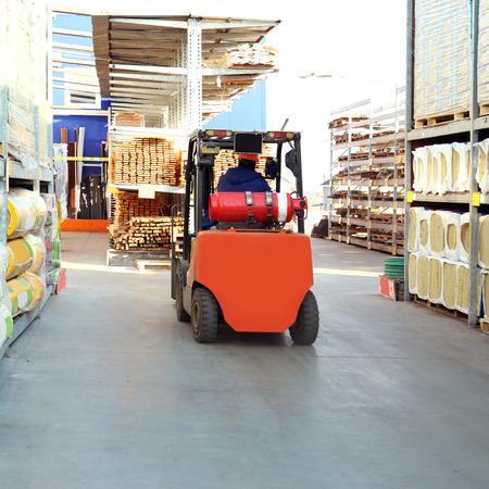 Stacking truck in wholesale warehouse