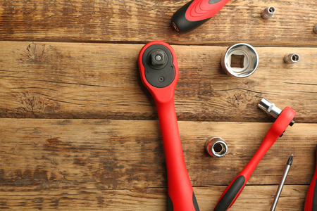 Setting of tools for car repair on wooden backgroundの写真素材