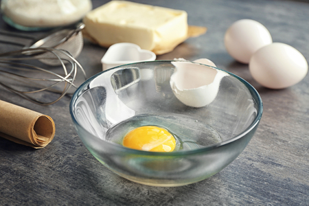 Ingredients for preparing butter cookies on kitchen tableの写真素材