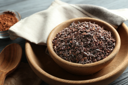 Composition with cocoa nibs on wooden tableの写真素材