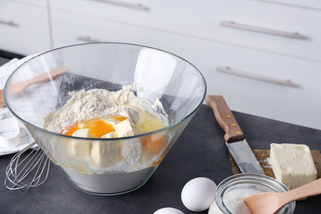 Ingredients for preparing butter cookies on kitchen tableの写真素材