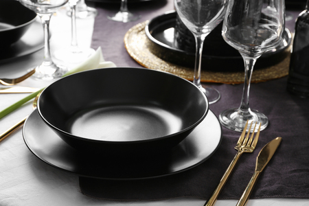 Table setting for dinner in restaurantの写真素材