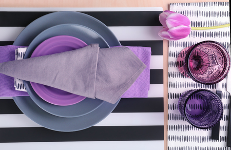 Table setting with beautiful tulip flowerの写真素材